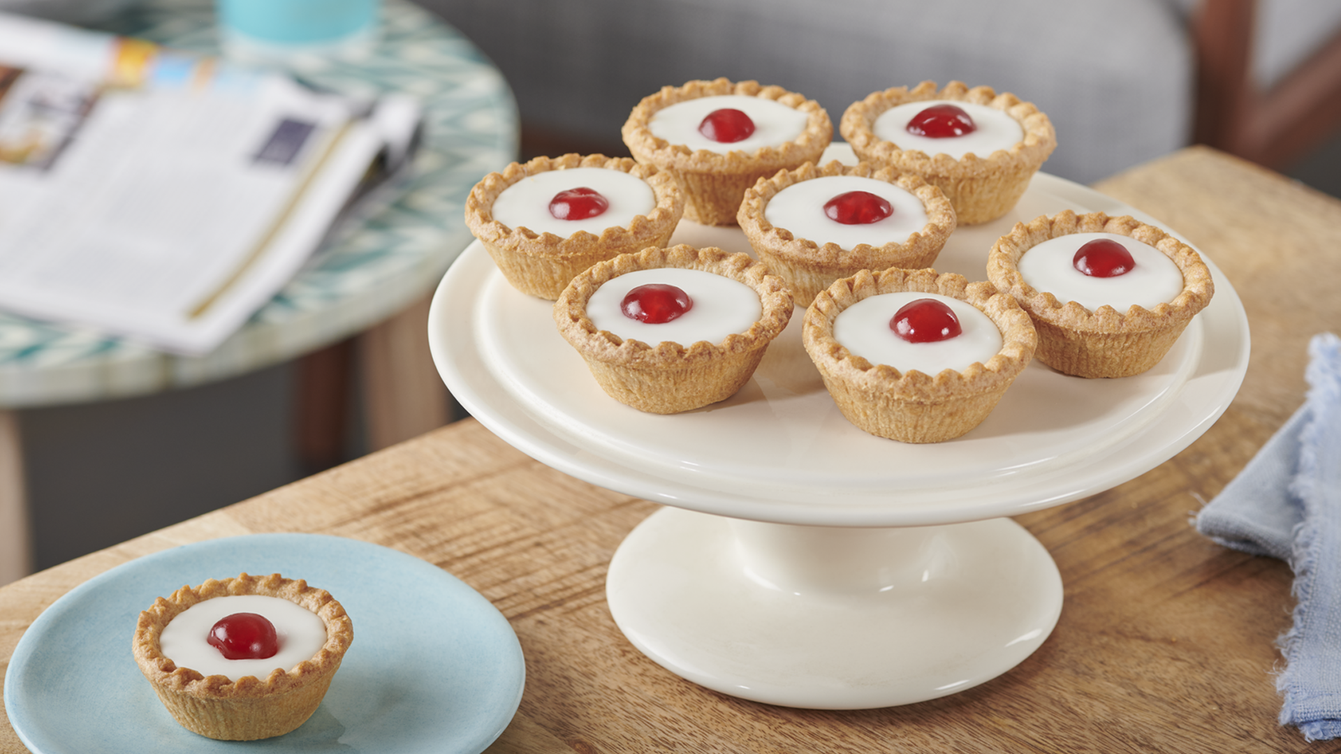 Mr Kipling Cherry Bakewells on a cake stand
