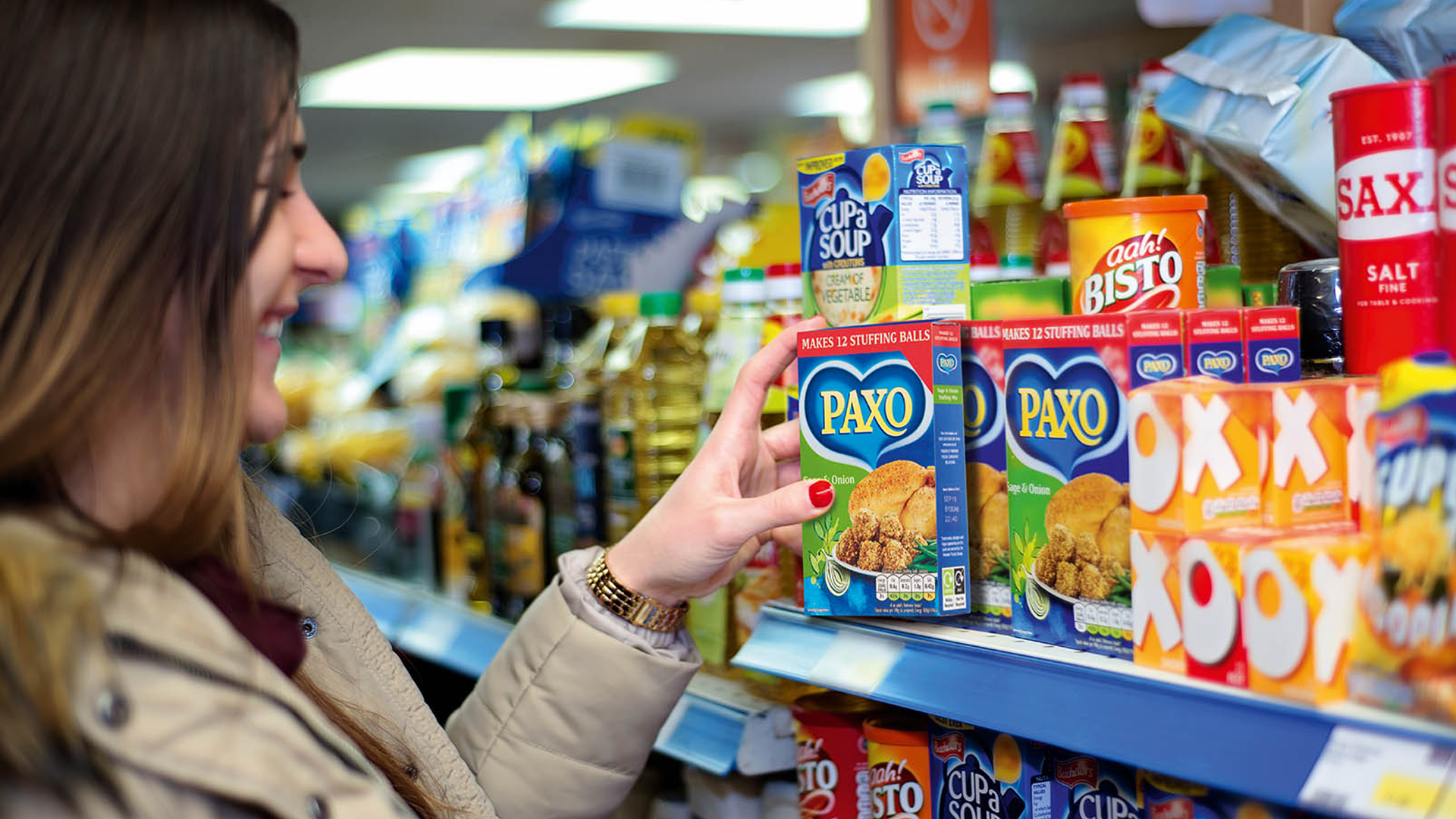 shopper browsing products on supermarket shelves